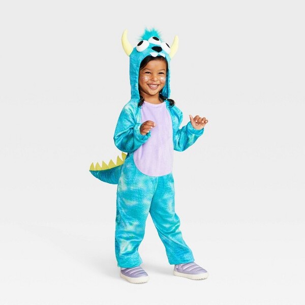 image of girl wearing a monster/dinosaur costume