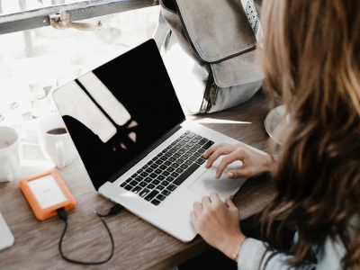 Photo of woman using a laptop