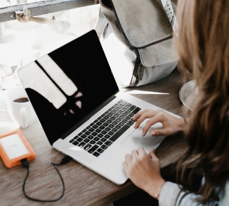 Photo of woman using a laptop