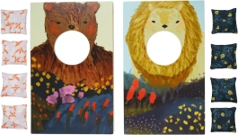 bean bag toss boards, one with a bear image and the other with a lion