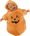 image of infant wearing an orange pumpkin costume