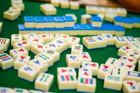 image of Mahjong tiles on a green table