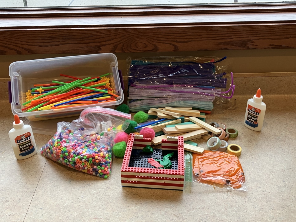 Variety of craft supplies out on table.