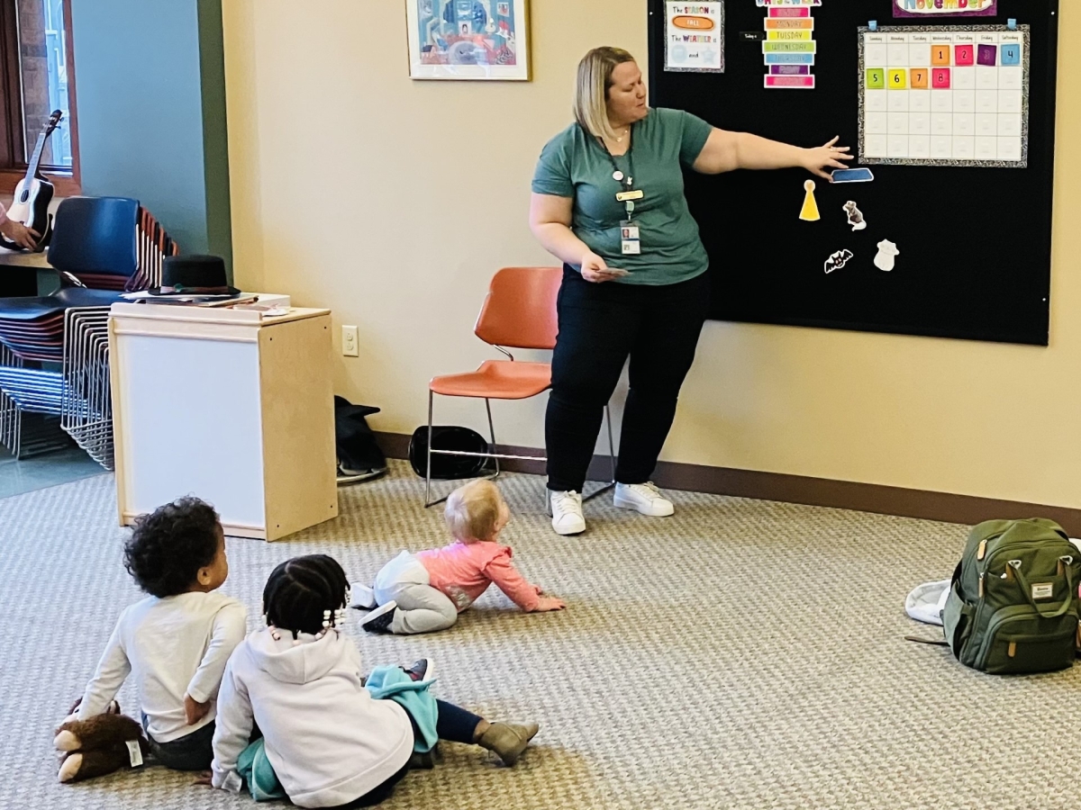 Librarian doing a flannel story with children 