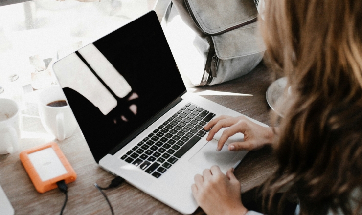 Photo of woman using a laptop