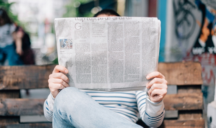 person reading the newspaper